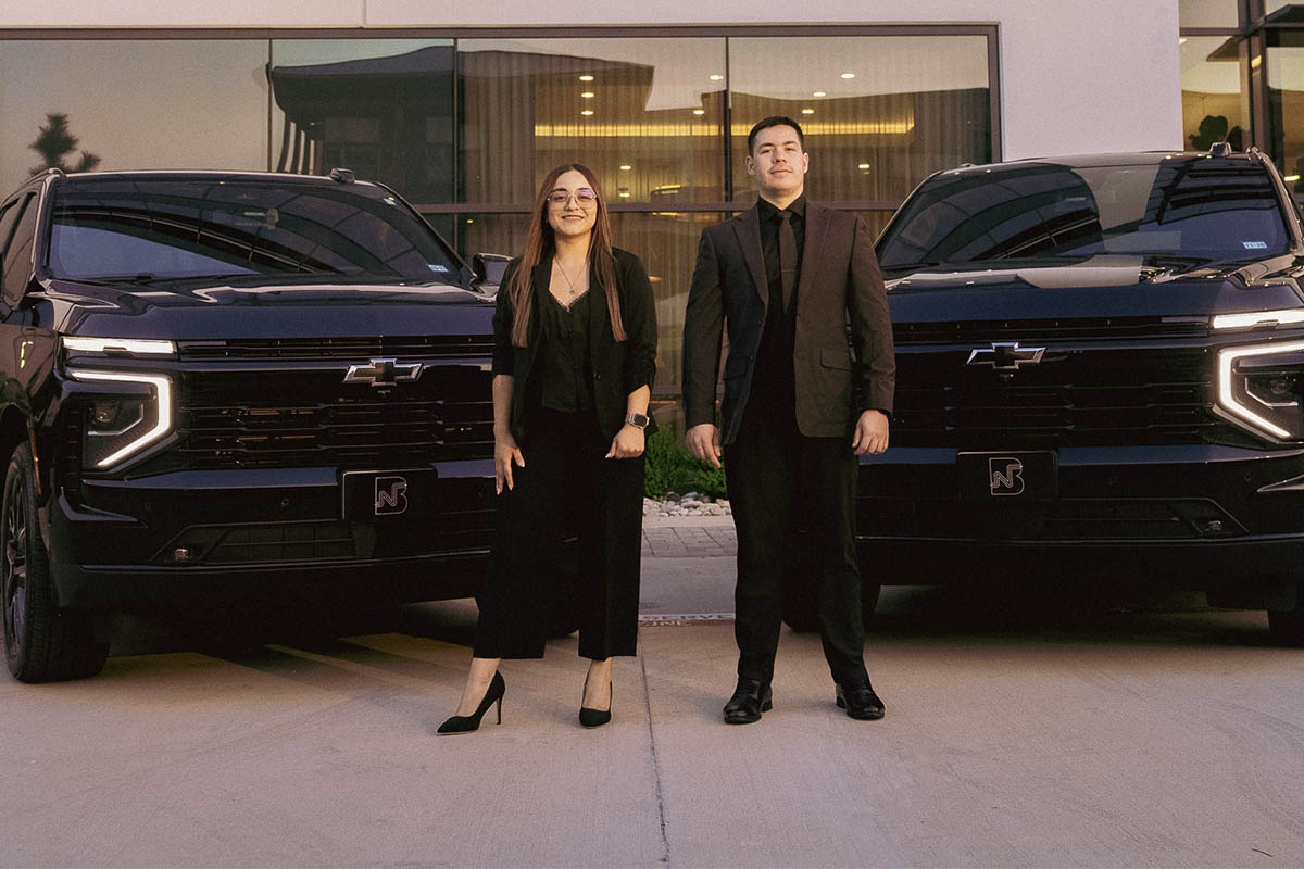Black Nexus owners standing in front of their fleet
